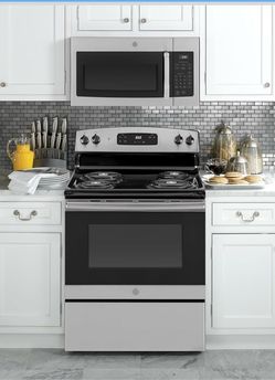 GE Stainless Steel is 1.6 cu ft OTR Microwave  NEW IN BOX