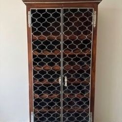 Rustic Wood Wine Cabinet with Decorative Metal Lattice Doors