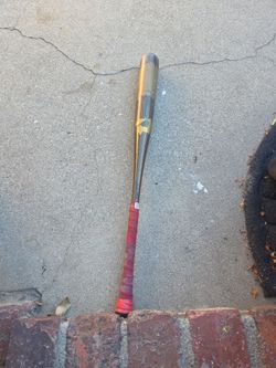 DeMarini Baseball Bat with Red Grip Tape
