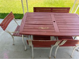 Patio table set with chairs and bench
