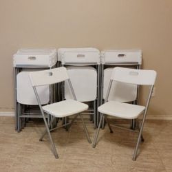 NEW WHITE FOLDING CHAIRS 