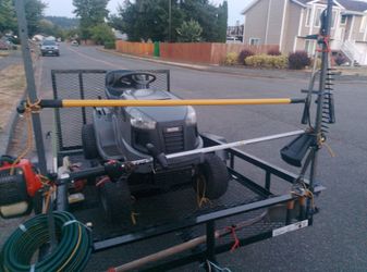 Lawn care trailer brand new lawnmower weed Wacker leaf blower shovels rakes weed sprayer hose