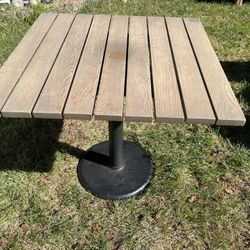 Bistro BarPub height Square Wood Top Patio Table. Sturdy square table. Has wood slatted top and black metal pedestal base. Great for outdoor use on a 