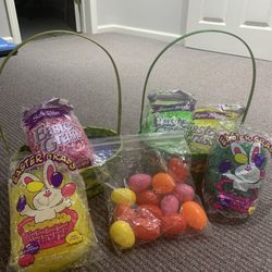 Two nice size Easter baskets five bags of Unopen Easter grass and 12 plastic eggs