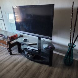 60 inch Sony Bravia TV with the entertainment stand