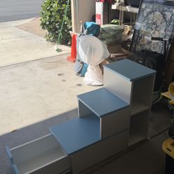 blue storage shelf built like stairs