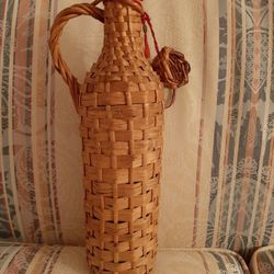 Vintage Greek wine bottle with wicker case.