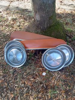 70's model Cadillac Hubcaps And Set Of Skirts