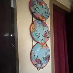 New wall shelf with decorative plates.