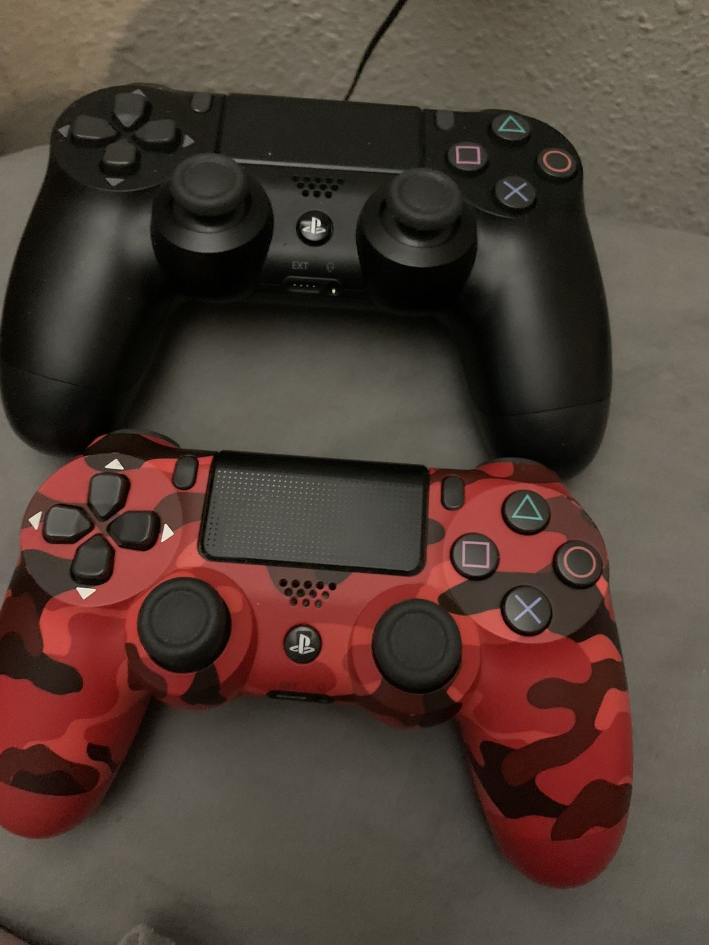 Two Ps4 Controllers One Red Camo &one Black 