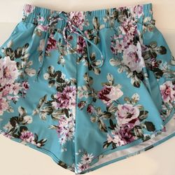 Teal flower women’s swim bottom shorts with an elastic marist & a tie Sz W XL 