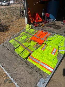 Used safety vest with hard hat