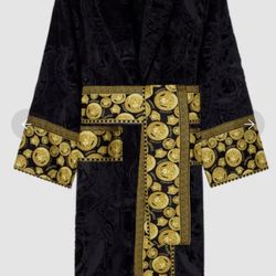  This is the iconic Medusa head design with the Greek key trim belt — one of Versace’s most recognizable luxury robe styles. Size L