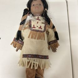 Indian doll never played with.  Cute feather braid in her hair