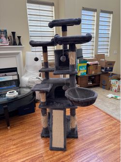 Large multi-level cat tree in good overall condition.