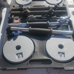 A Lot Of Different Weights Plates And Barbell And Curl Bars