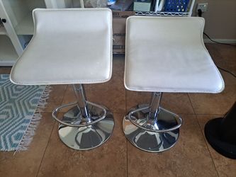 2 white and chrome barstools