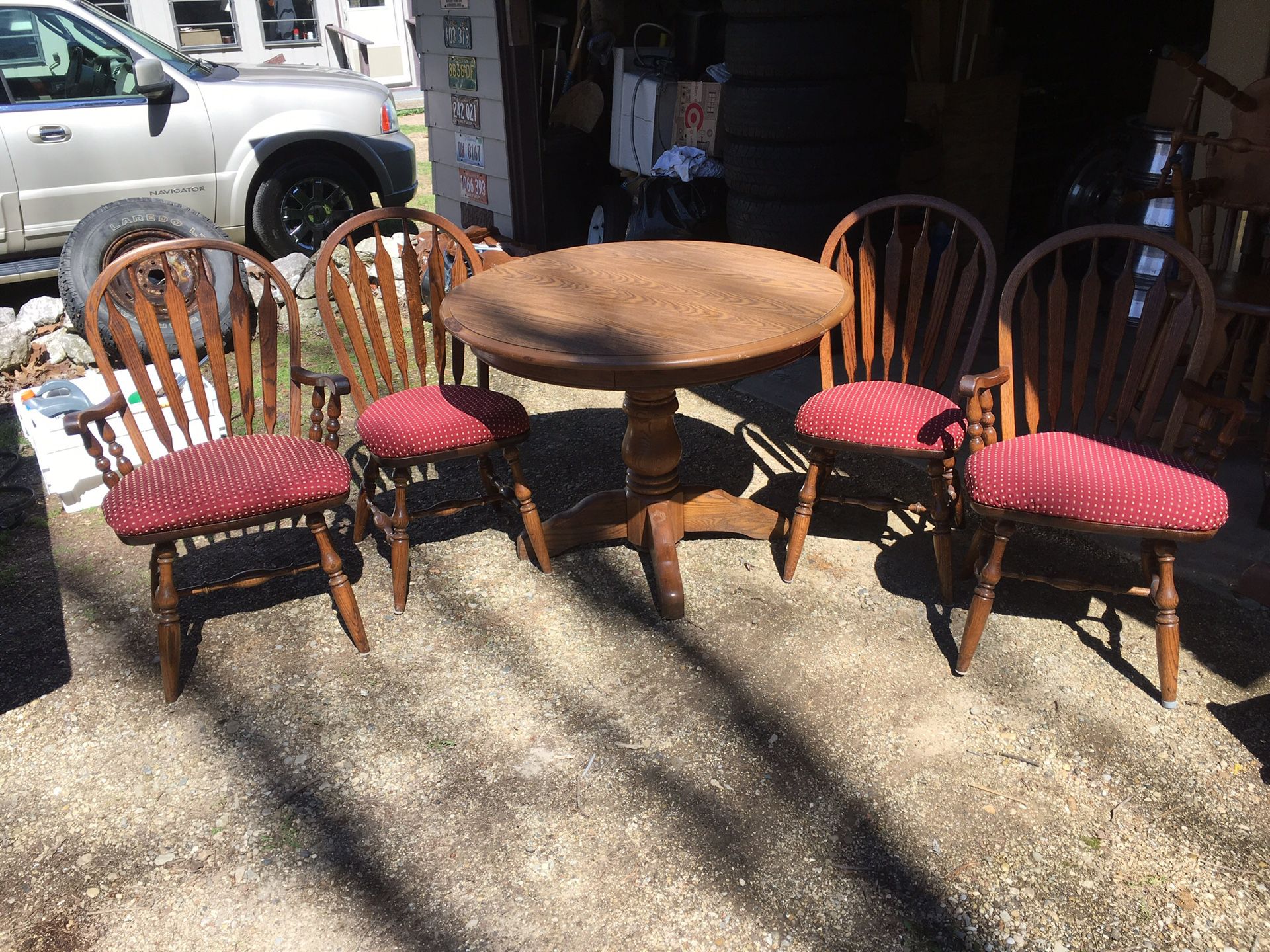 Five piece dining room set table and four chairs with attached cushions solid and $110