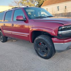 LIFTED SUBURBAN TV RADIO 4X4 FLEX FUEL GAS