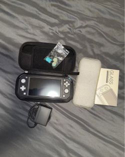 Nintendo Switch Lite + Protective Cases, Charger & Accessories