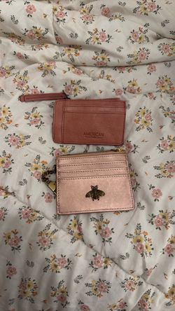 Bundle of cute small pink wallets