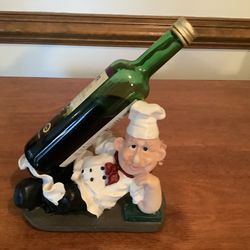 Chef holds wine or oil bottle great for the chefs kitchen