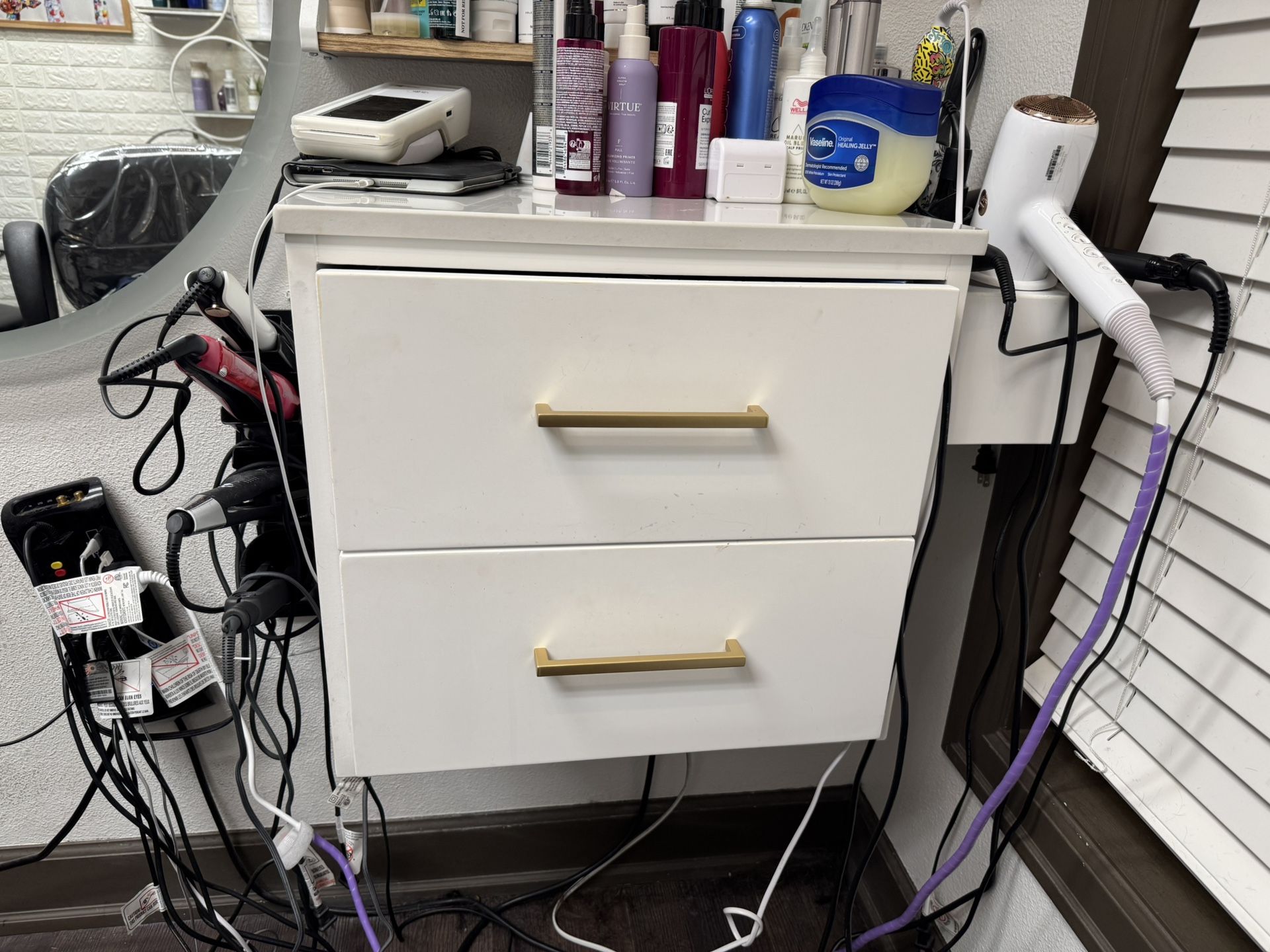 Hair Salon Wall Mount Station With a White Granite Top.