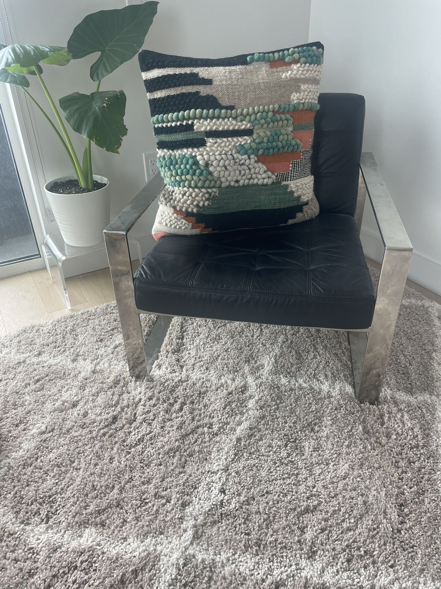 Black leather metal accent chair