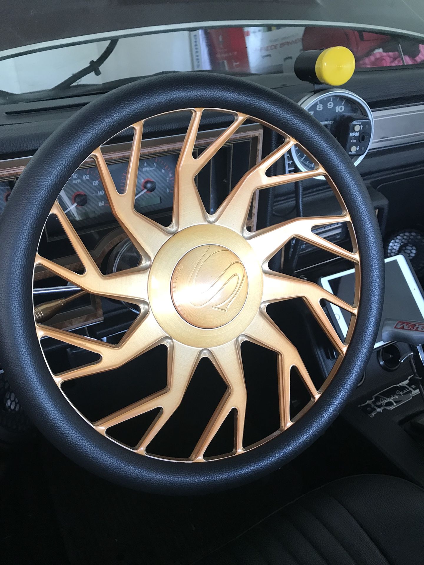 All gold steering wheel and all gold 26 inch savini rims