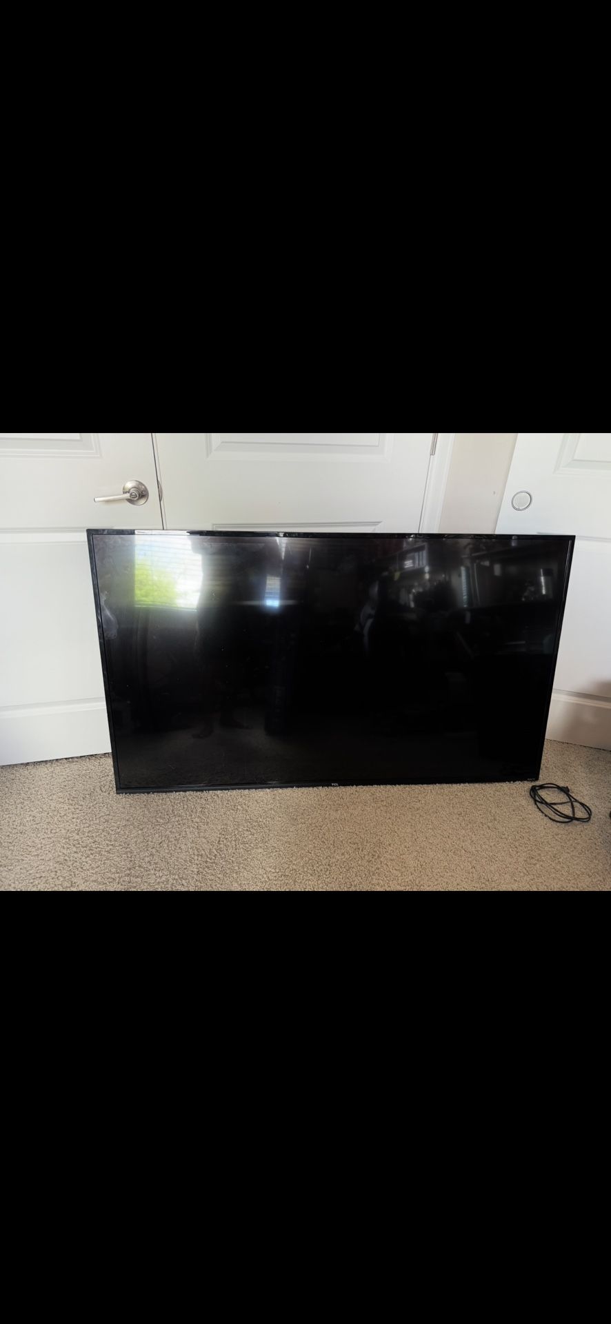 SELLING FOR PARTS 65 inch TCL Roku Tv- TV TURNS ON BUT SCREEN IS BLACK $100 OR BEST OFFER. No legs