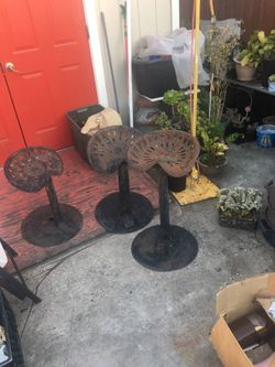  Three tractor seat stools yard art
