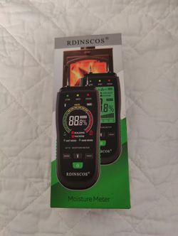 RDINSCOS MT19 digital moisture meter for testing wood and building materials.
