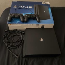 PS4 Pro 1TB – 2 Controllers + Original Box – Good Condition