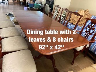 Dining table with two leaves and 8  chairs  -  $400
