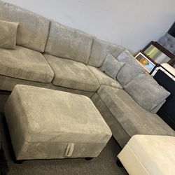 Light grey new floor model sectional just arrived free storage ottoman  was $999 now $650 ready for delivery $99
