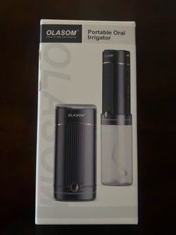 Portable oral irrigator