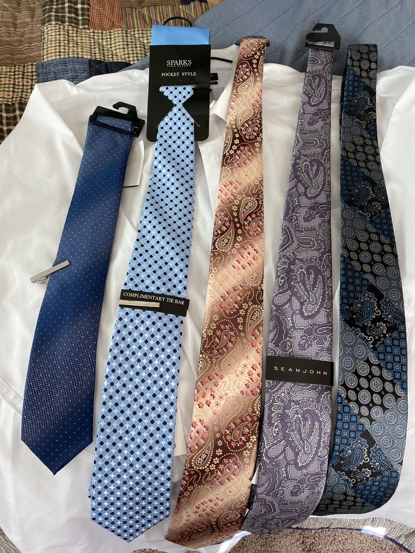 Brand new! 5 ties. 2 tie bars and pocket cloth.