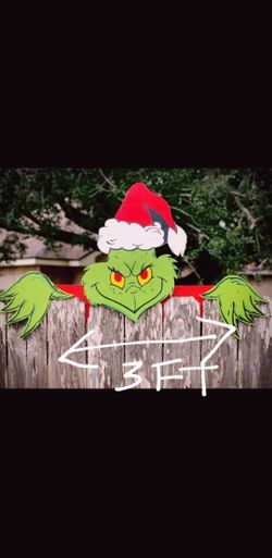 grinch over the fence