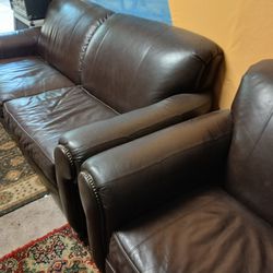 Two leather brown sofa and love seat