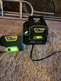 Two Kobalt Batteries And Charger