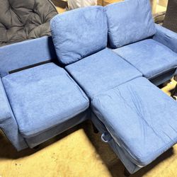 Damaged sofa for sale. Stained and missing parts.