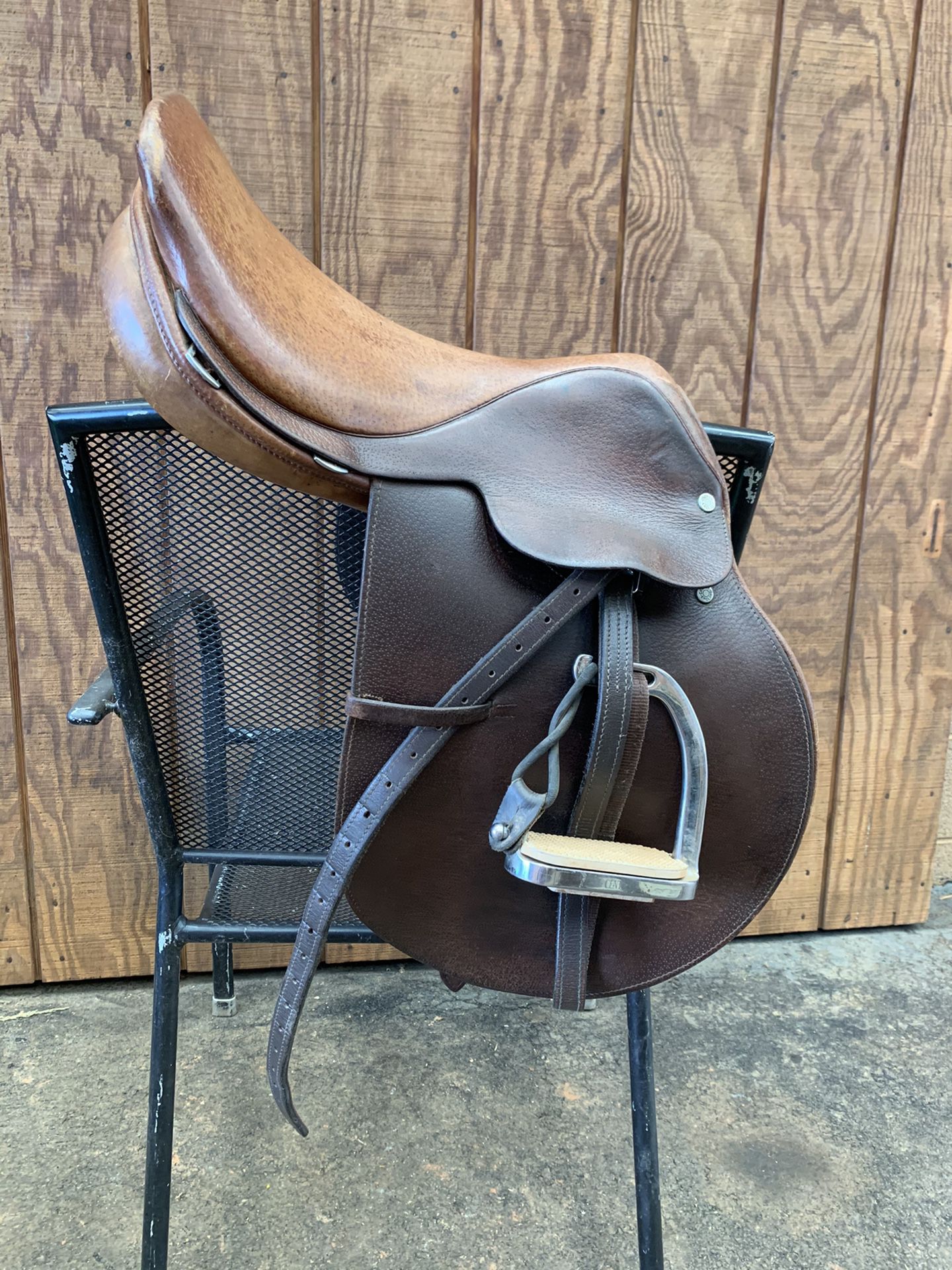 15 1/2 Crosby saddle with leathers and peacock stirrups. 200.00