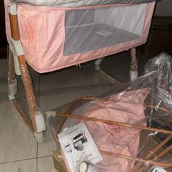 Gray bassinet that hooks up to your bed
