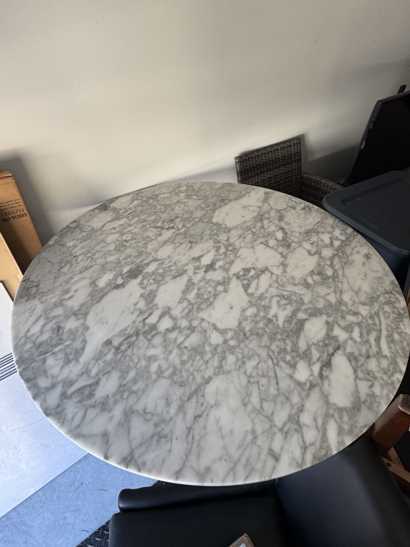 Round Marble Table + Four Black Chairs