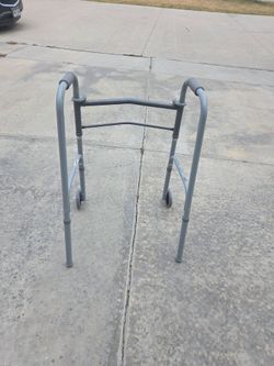 Sturdy metal walker with adjustable height and wheels for sale Cash only