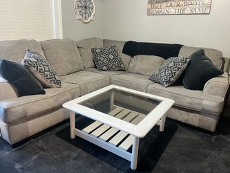 Rustic wood with glass top coffee table.