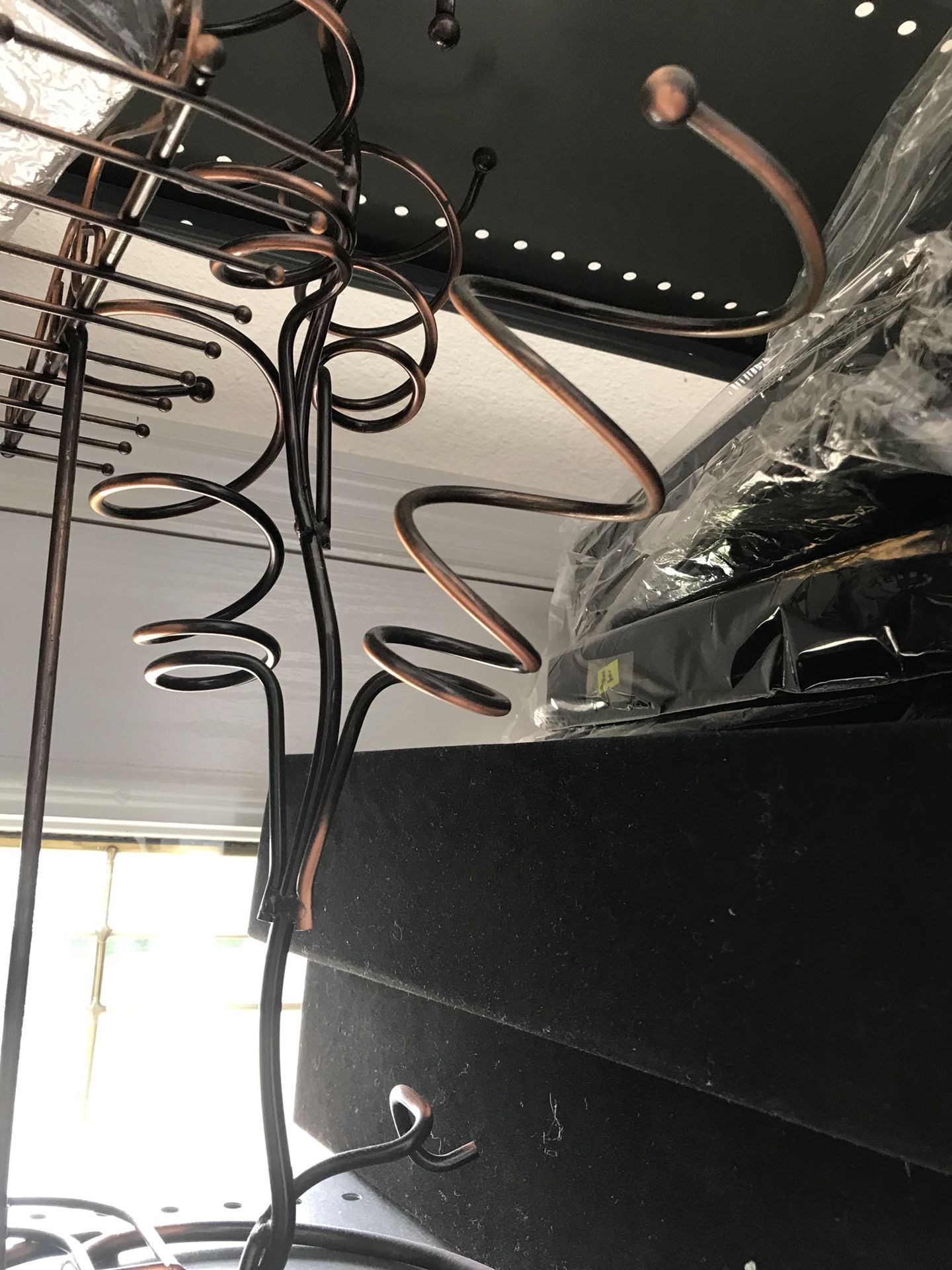 Wine bottle stand holds 3 copper color