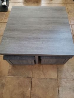 Coffee table w/storage ottomans