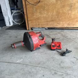 Milwaukee handheld drain cleaner w/ charger and m18 battery also m12 battery 