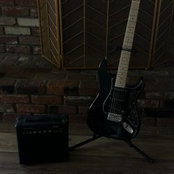 Electric Guitar With Stand And Speaker